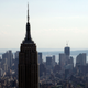 FILE - This Aug. 30, 2011, file photo, shows the Empire State Building in an aerial view of the Manhattan skyline in New York. The Empire State building was New York's tallest from 1931-1972, until the completion of the World Trade Center. It became the tallest once again when two planes crashed into the World Trade Center in a terrorist attack, causing the twin 110-story towers to collapse on Sept. 11, 2001. On Monday, April 30, 2012, One World Trade Center _ being built to replace the twin towers destroyed on 9/11 _ gets steel columns to make its unfinished framework a little higher than the Empire State Building's observation deck, to become the tallest building in New York.